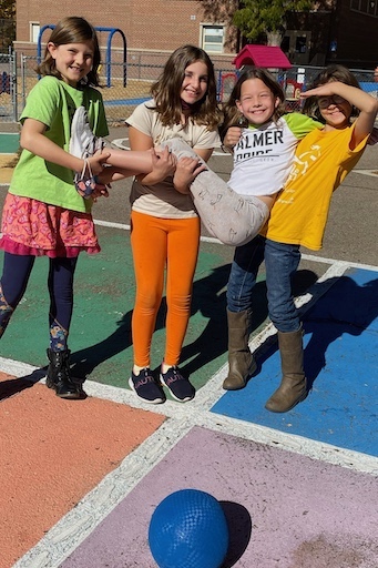 Group of students posing on the playground